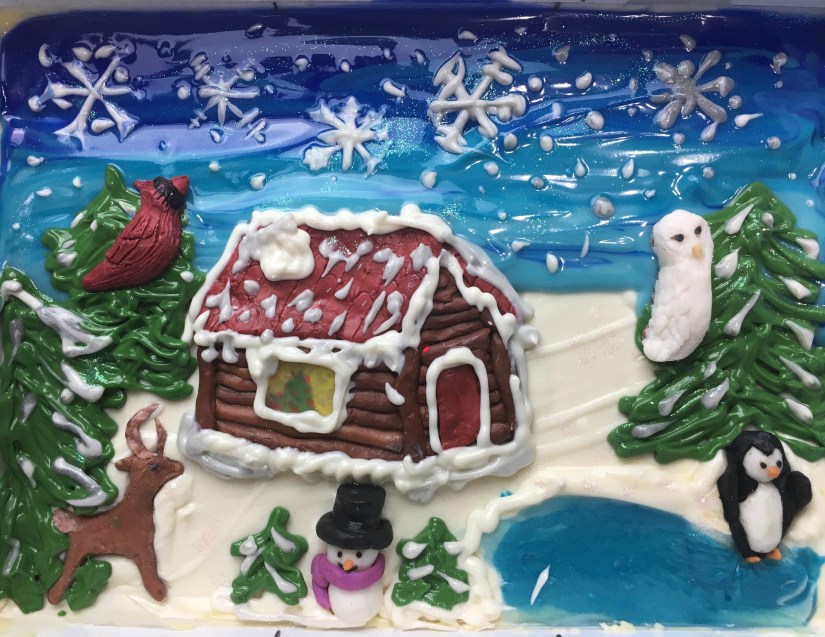 Christmas soap in slab mold featuring a frozen lake, snowflakes, a white owl, a penguin, a cabin, snowman and deer