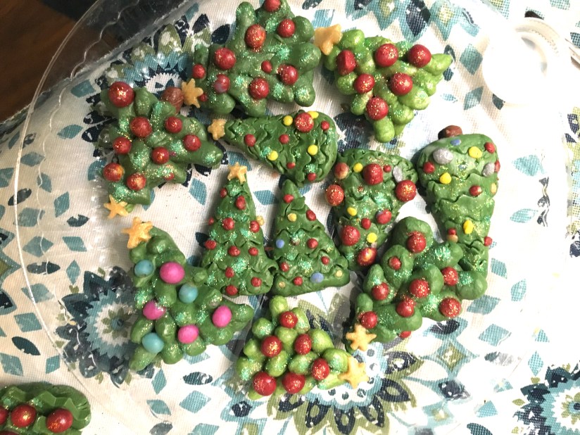 Miniature Christmas trees made with soap with red ornaments and glitter