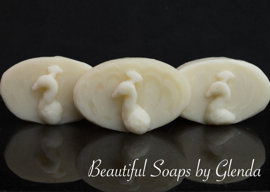 Oval off white soaps with peacock and ghost swirl technique